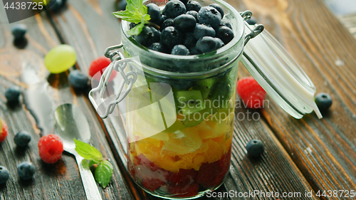 Image of Fresh fruits in glass jar 