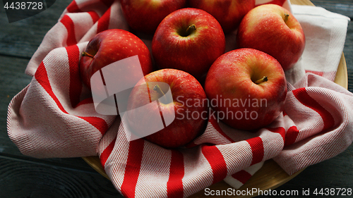 Image of Fresh apples on striped towel 