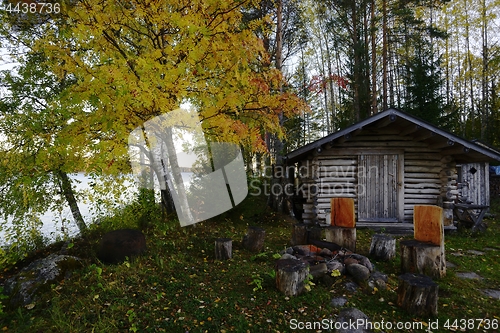 Image of fishing hut and grill place on the shore of a lake