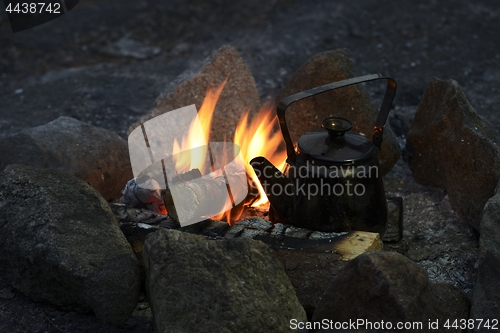 Image of tourist kettle on the campfire
