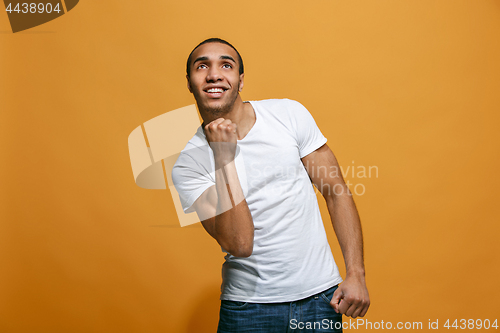 Image of Winning success man happy ecstatic celebrating being a winner. Dynamic energetic image of male model