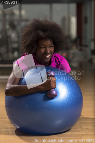 Image of woman  relaxing after pilates workout