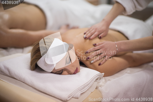 Image of couple receiving a back massage