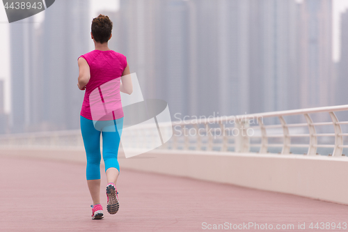 Image of woman running on the promenade