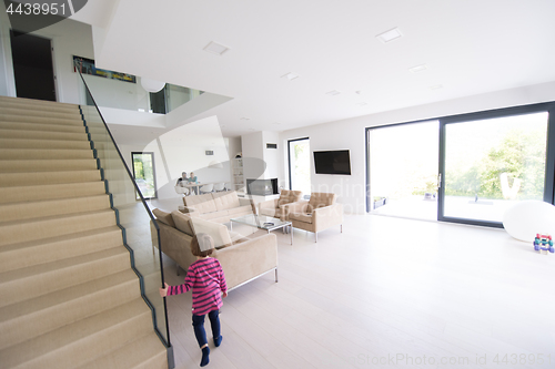 Image of family with little girl enjoys in the modern living room