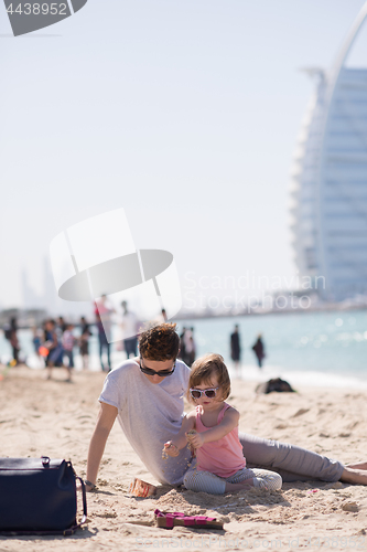 Image of Mom and daughter on the beach