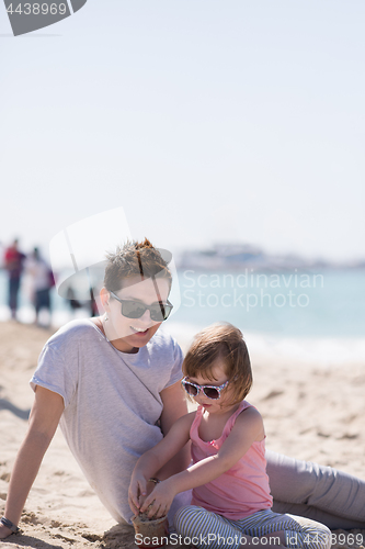 Image of Mom and daughter on the beach