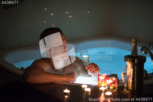 Image of man relaxing in the jacuzzi