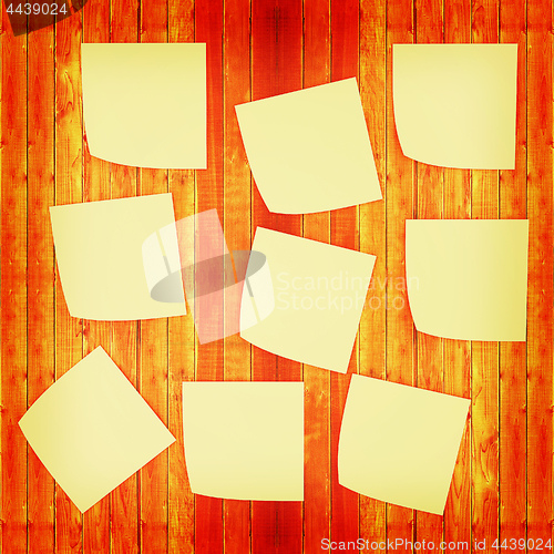 Image of Mock-up of Sticky note paper on a wooden wall. 3D illustration. 