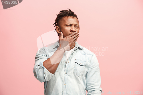 Image of Young serious thoughtful Afro-American businessman. Doubt concept.