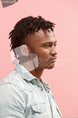 Image of Beautiful Afro-American man looking suprised and bewildered isolated on pink