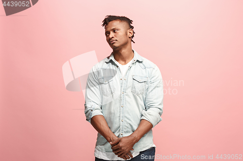 Image of Beautiful afro man looking suprised and bewildered isolated on pink