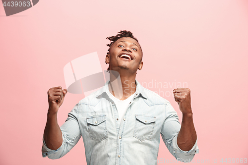 Image of Winning success man happy ecstatic celebrating being a winner. Dynamic energetic image of male model