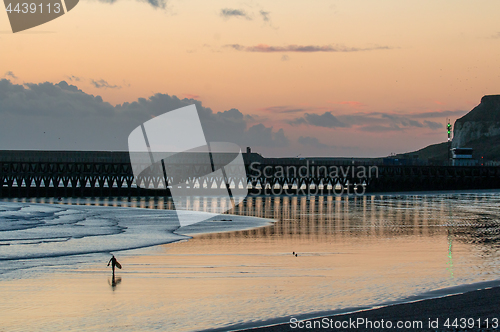 Image of Surfer Walking on Beach