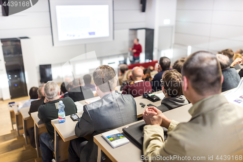 Image of Business speaker giving a talk at business conference event.