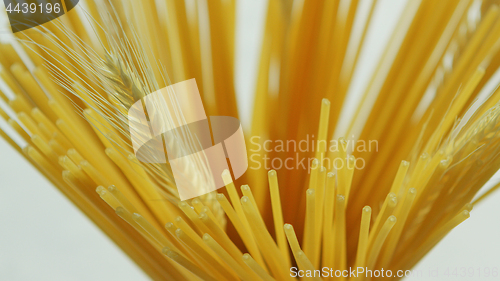 Image of Bunch of uncooked spaghetti and wheat