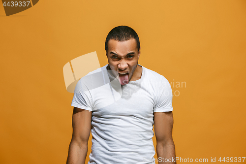 Image of The young emotional angry and scared man standing and looking at camera