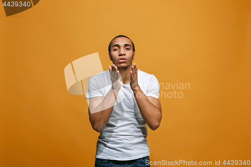 Image of Portrait of attractive man with kiss isolated over studio background
