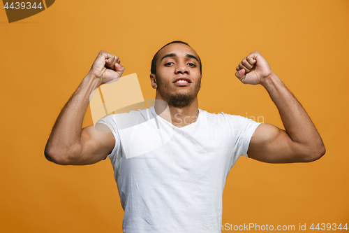 Image of Winning success man happy ecstatic celebrating being a winner. Dynamic energetic image of male model