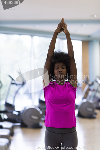 Image of african american woman exercise yoga in gym