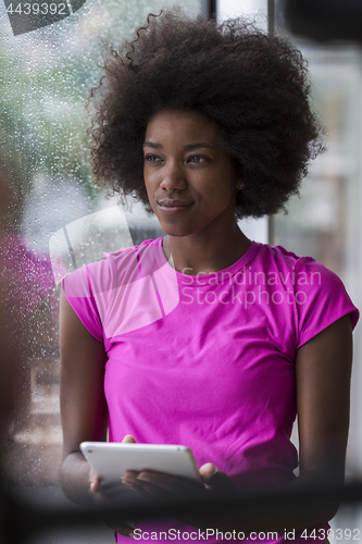 Image of african american woman using tablet