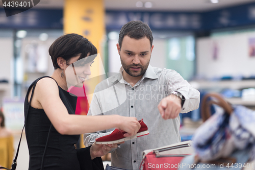 Image of couple chooses shoes At Shoe Store