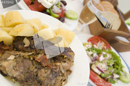 Image of lamb in the paper greek island taverna food