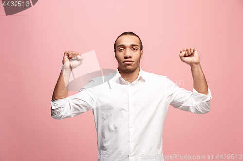 Image of Winning success man happy ecstatic celebrating being a winner. Dynamic energetic image of male model