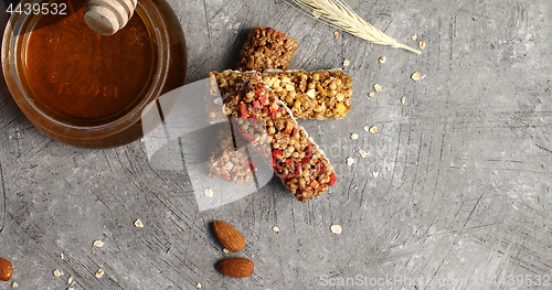 Image of Oat bars and jar of honey