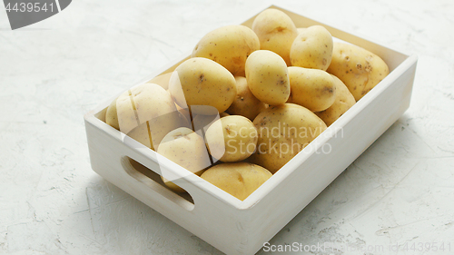 Image of Box of clean and washed potatoes