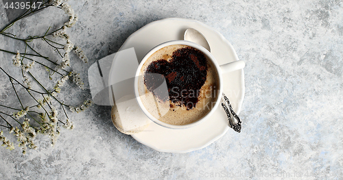 Image of Cup of coffee with heart made of foam