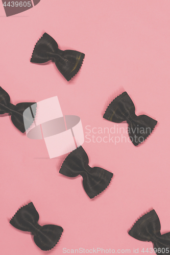 Image of Black pasta farfalle lies diagonally