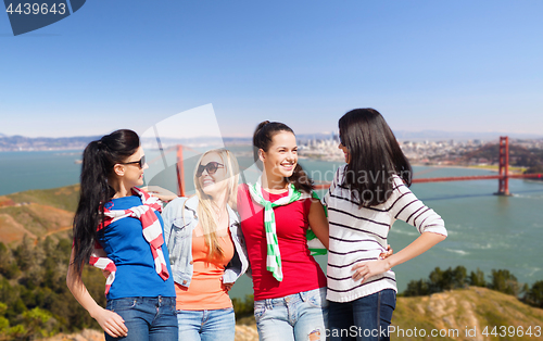 Image of happy young women over golden gate bridge