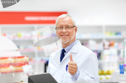 Image of senior with tablet pc at pharmacy