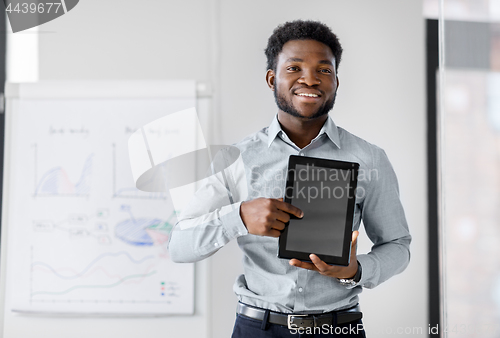 Image of businessman with tablet pc at office presentation