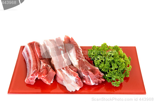Image of Pork ribs on red plate