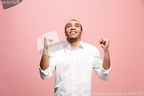 Image of Winning success man happy ecstatic celebrating being a winner. Dynamic energetic image of male model