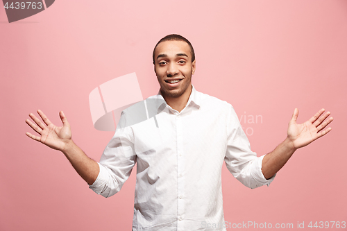 Image of Handsome man looking suprised isolated on pink