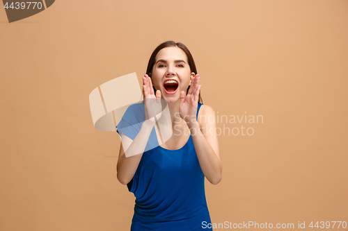 Image of Isolated on pastel young casual woman shouting at studio