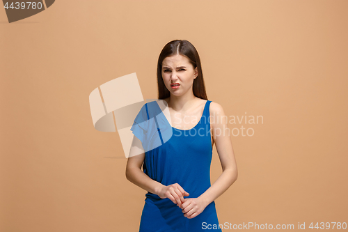 Image of Disgust woman with thoughtful expression making choice against pastel background
