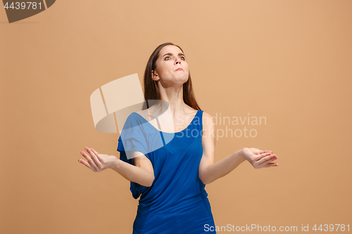 Image of Portrait of an argue woman isolated on a pastel background