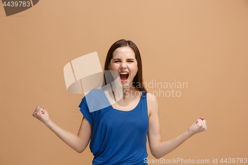 Image of Winning success woman happy ecstatic celebrating being a winner. Dynamic energetic image of female model