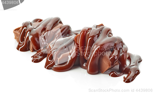 Image of chocolate pieces covered with melted chocolate