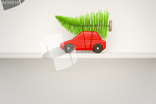 Image of red toy car with green christmas tree 