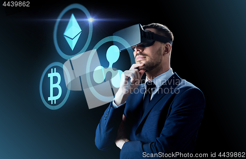 Image of cryptocurrency and businessman in virtual headset