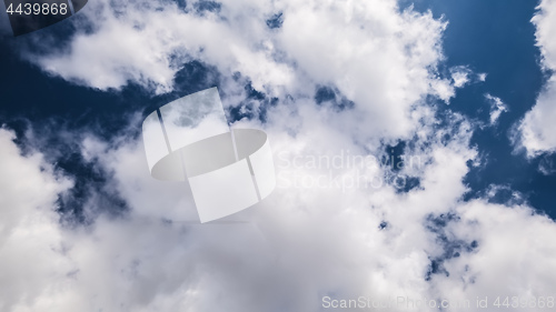 Image of dark sky with white clouds