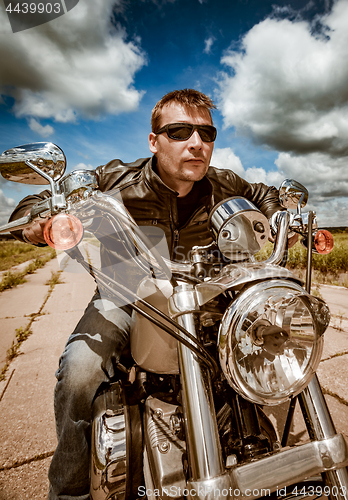 Image of Biker racing on the road