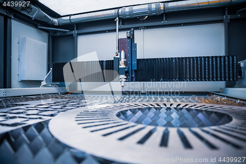 Image of CNC Laser cutting of metal, modern industrial technology.