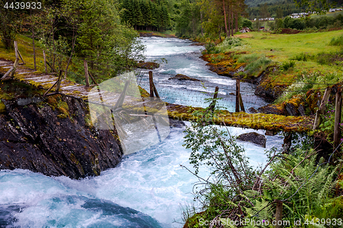 Image of Suspension bridge over the mountain river, Norway.