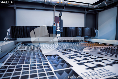 Image of CNC Laser cutting of metal, modern industrial technology.